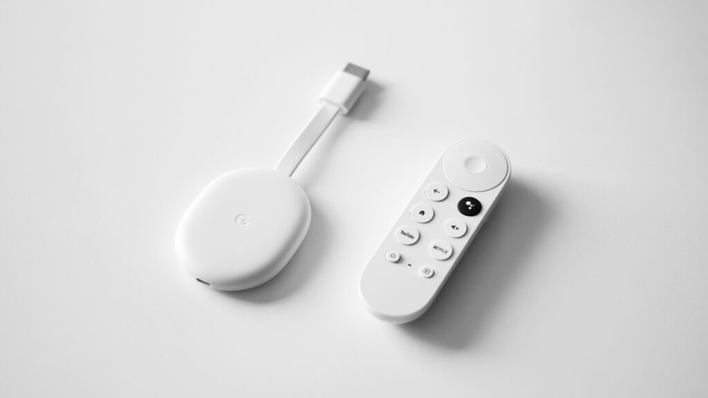  A Google Chromecast device connected to a TV, allowing media streaming from smartphones, tablets, and computers.